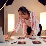 A lady employee searching for Ad Mediation's Guide in laptop.